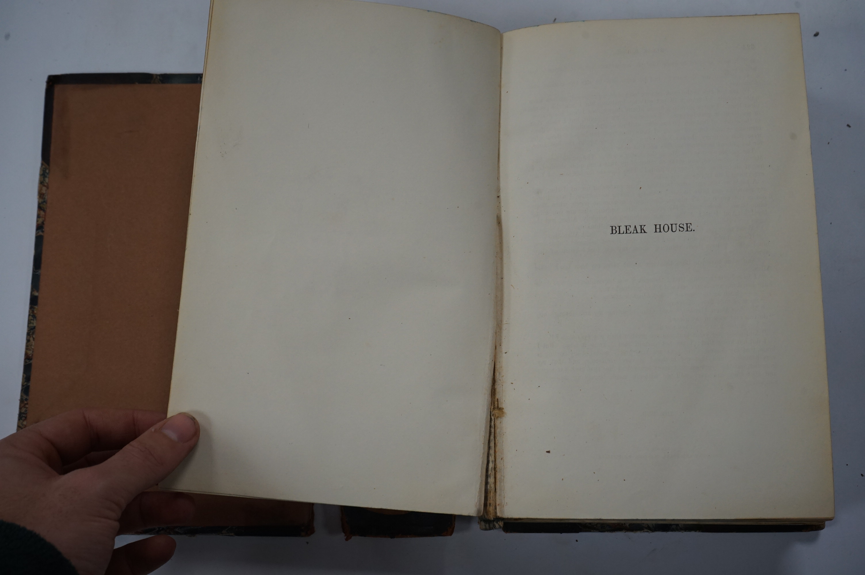 Dickens, Charles - Bleak House. First Edition. pictorial engraved and printed titles, frontis and 38 plates (by H.K. Browne); contemp. half calf and marbled boards (distressed), gilt decorated panelled spine and marbled